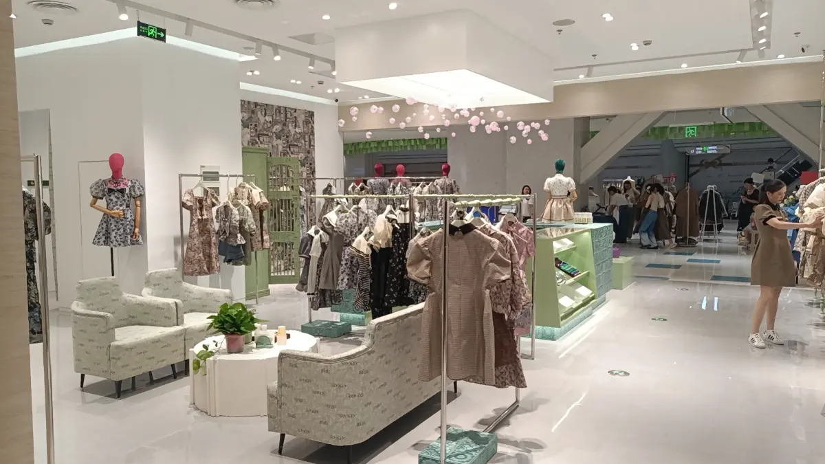 European flair ladies’ fashion store with cohesive clothing racks and clean sightlines